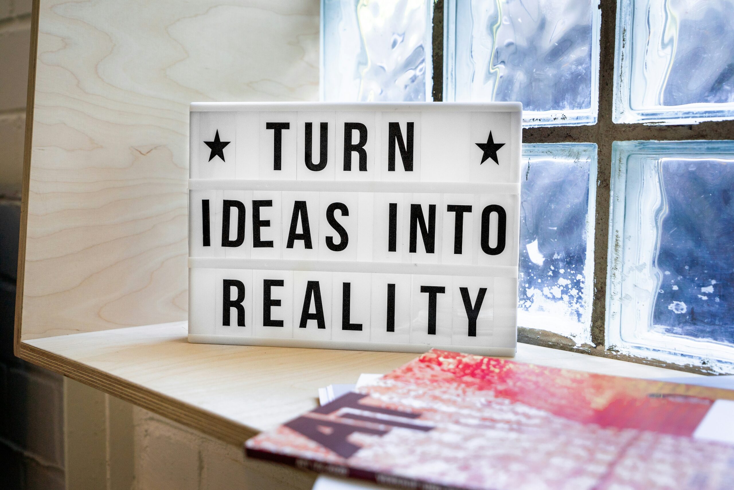 Sign by window: Turn ideas into reality